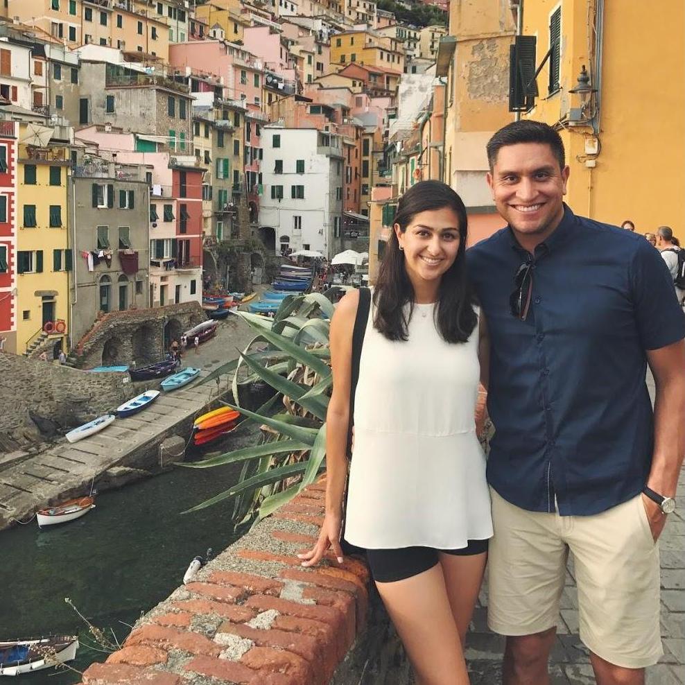 Us on the mountainous coast of Italy - in Cinque Terre - right before catching an amazing sunset