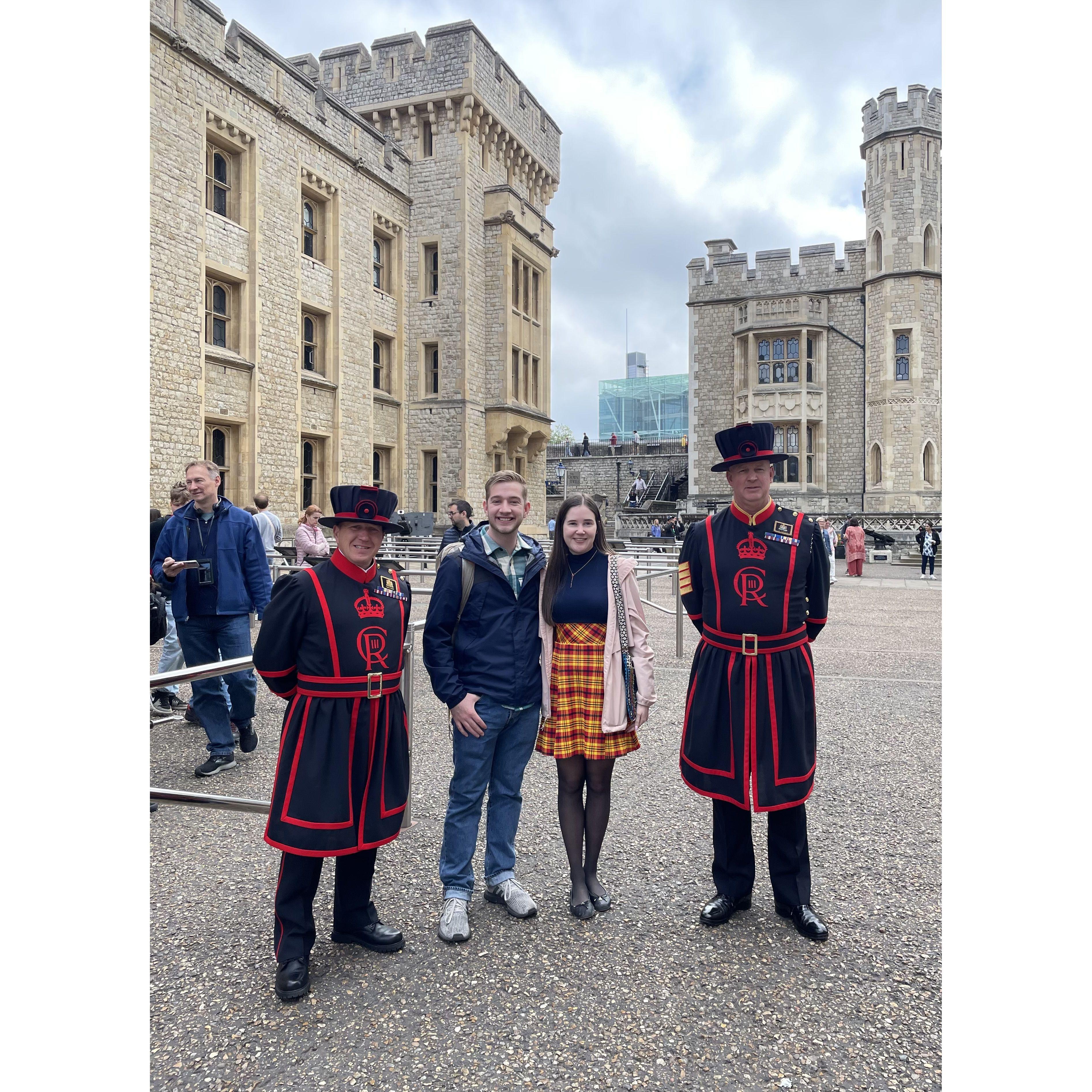 Standing by "beefeaters" at the Tower of London
