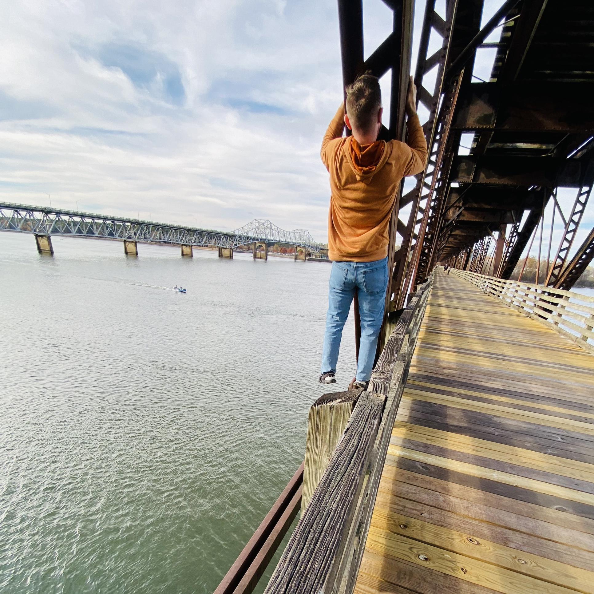 Crazy man! Hanging from Railroad bridge