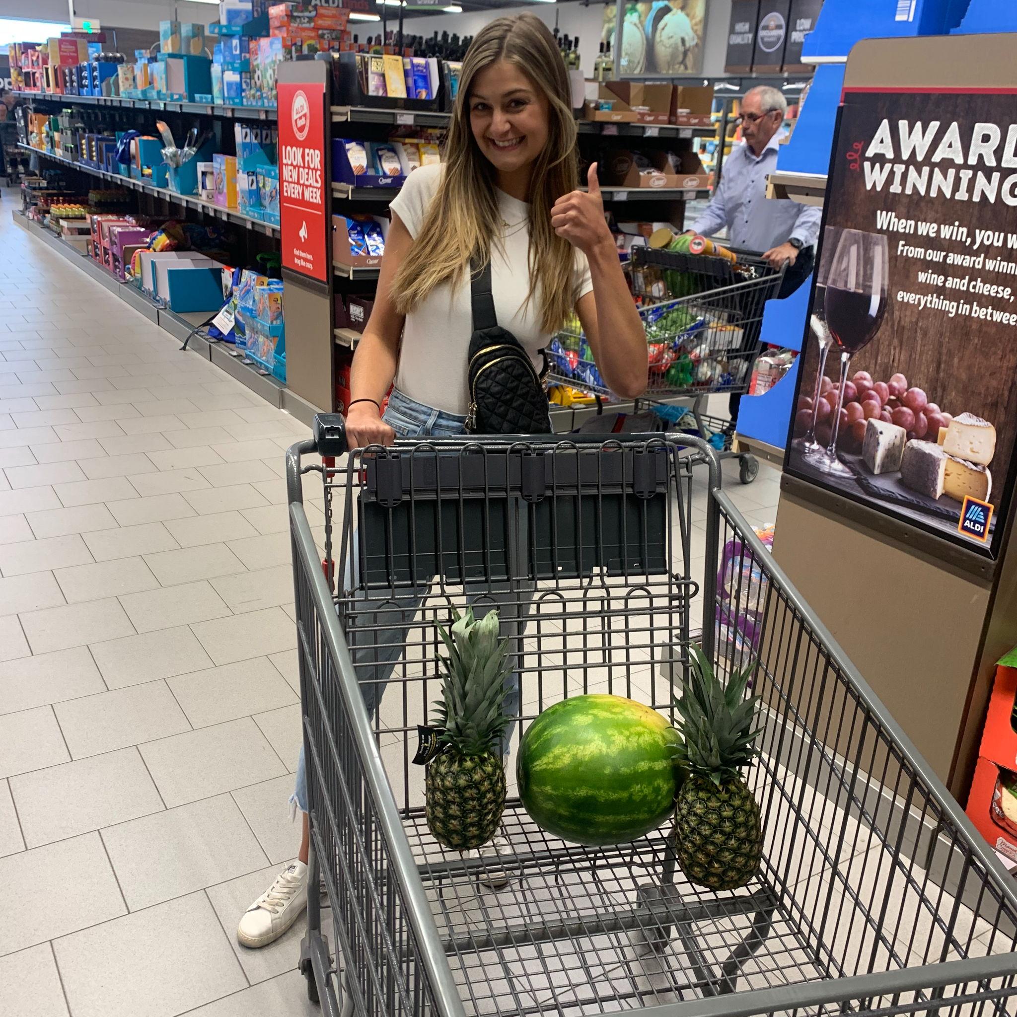 Picking out our first watermelon together - we had to watch TikToks to get it right.