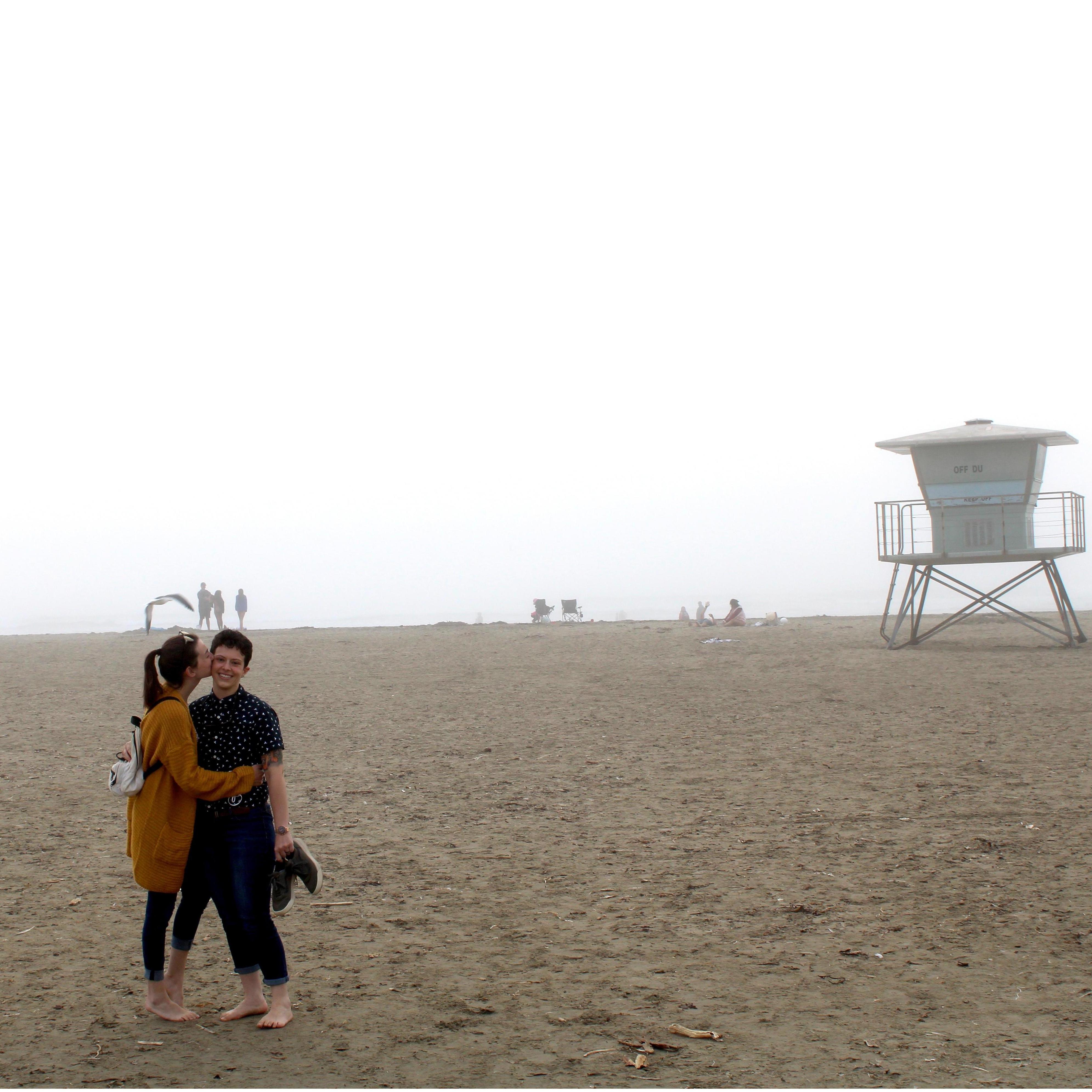 A big smooch on a trip to Morro Bay, CA on a cloudy day in October 2020