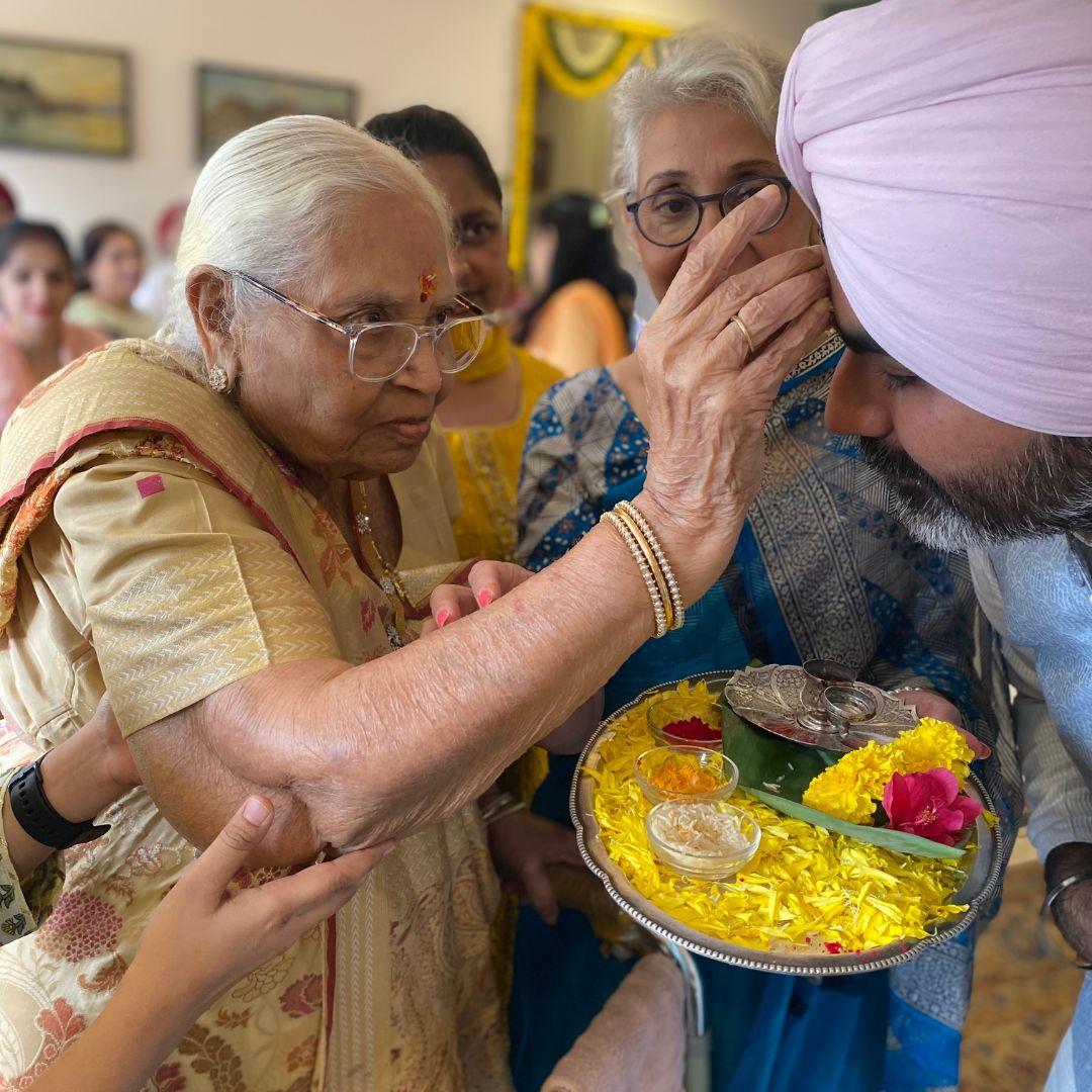 Rajbir receiving Grandma's blessing