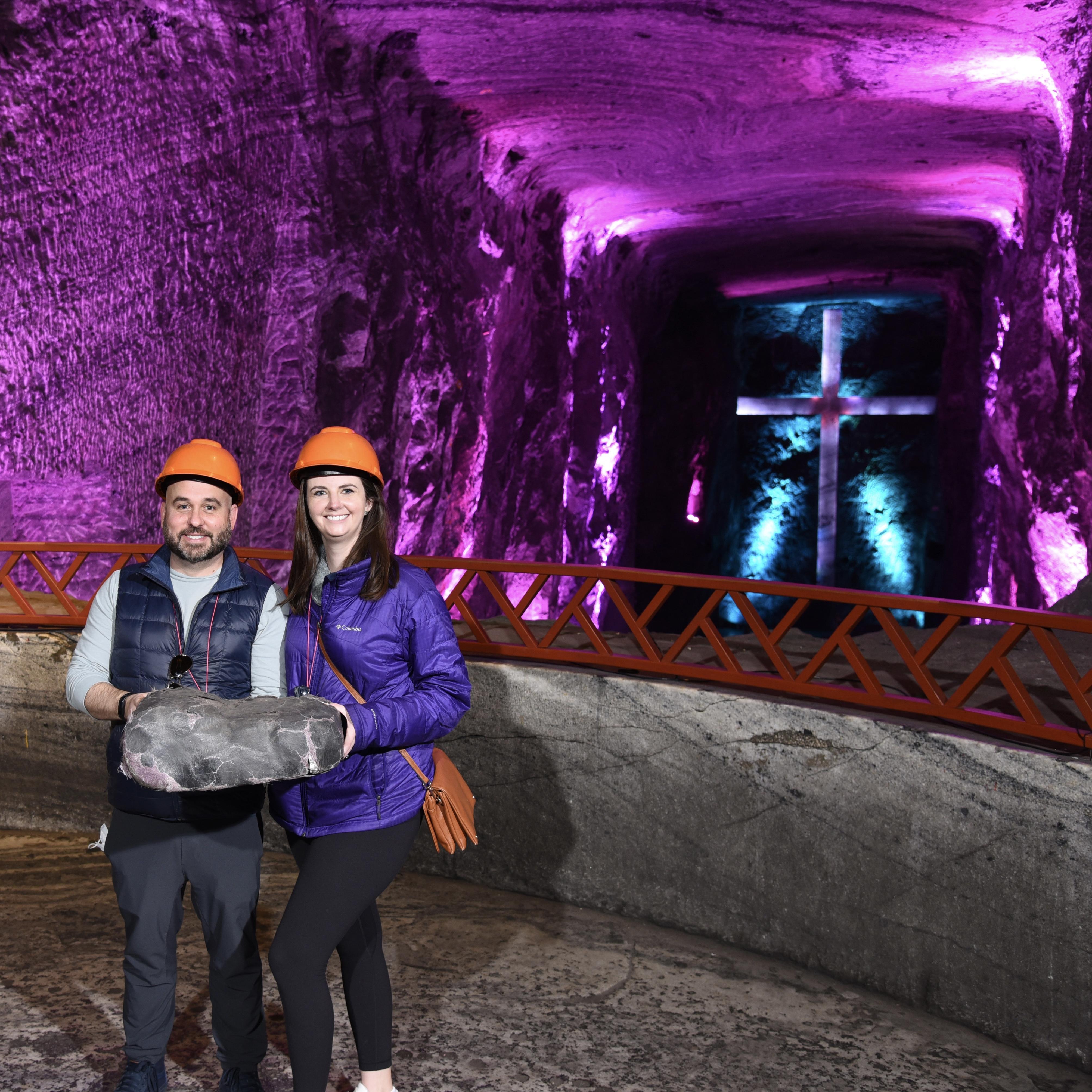 Holding a fake rock in the Salt Cathedral outside of Bogota, Colombia. Behind us is the largest underground cross in the world until someone buys Michael a backhoe.