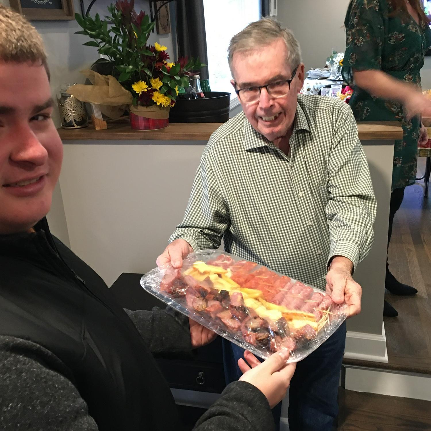 According to Zilly family tradition, a boyfriend must bring a gift of meat if he wants to join for Thanksgiving for the first time! Cole gave Grandpa Fred a platter of smoked sausages.