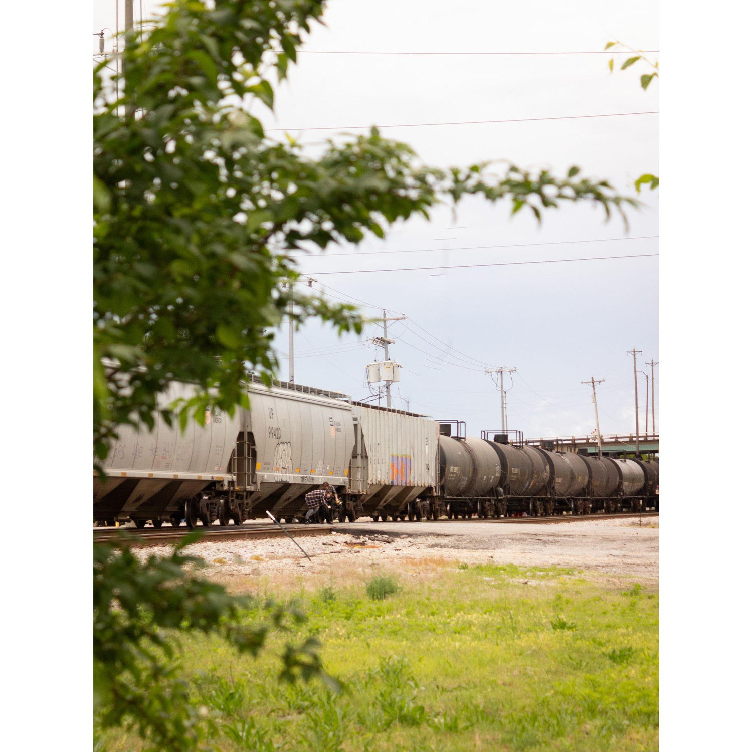 Zach and Madeline crawling under a train right before he proposes to her