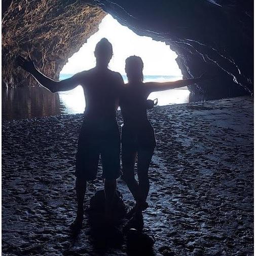 A sort-of cave hike together! (ok, a cave-visit) On Kalalau Beach at the end of the trail