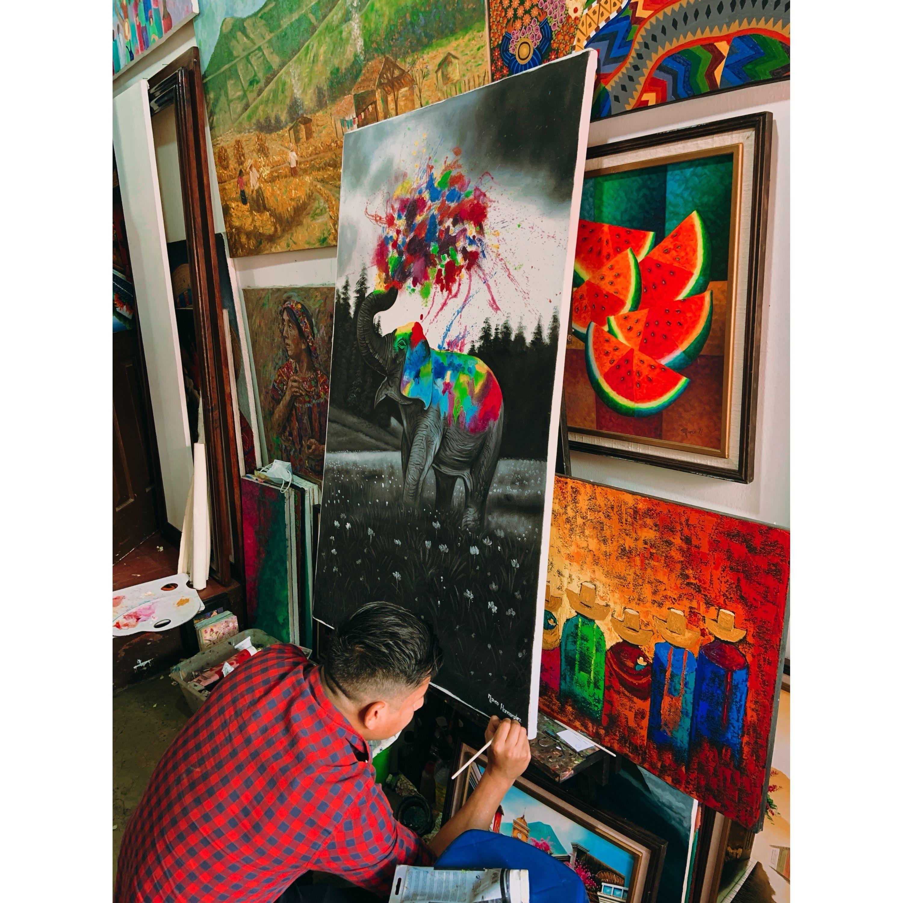 Guatemala; known for their beautiful art - we bought a piece from this gentleman