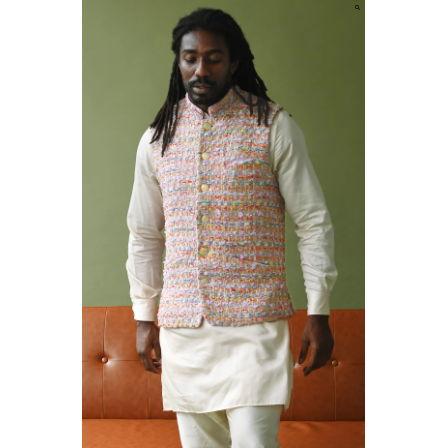Different fabrics can pair nicely together! Pictured is a men's Kurta with vest