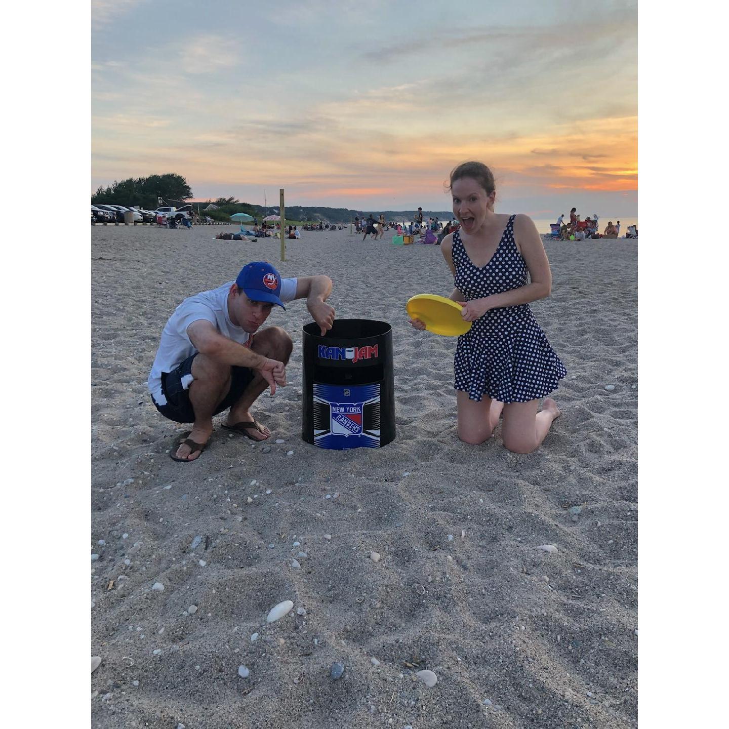 Maria taught Andrew how to throw a frisbee with the aid of Matt's Rangers-themed Kan Jam (oops)