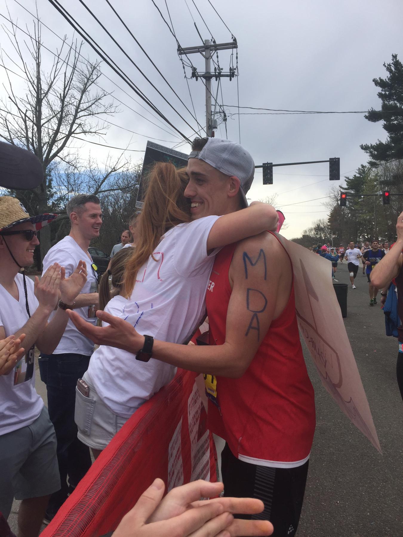 Hugs on the course at the 2017 Boston Marathon