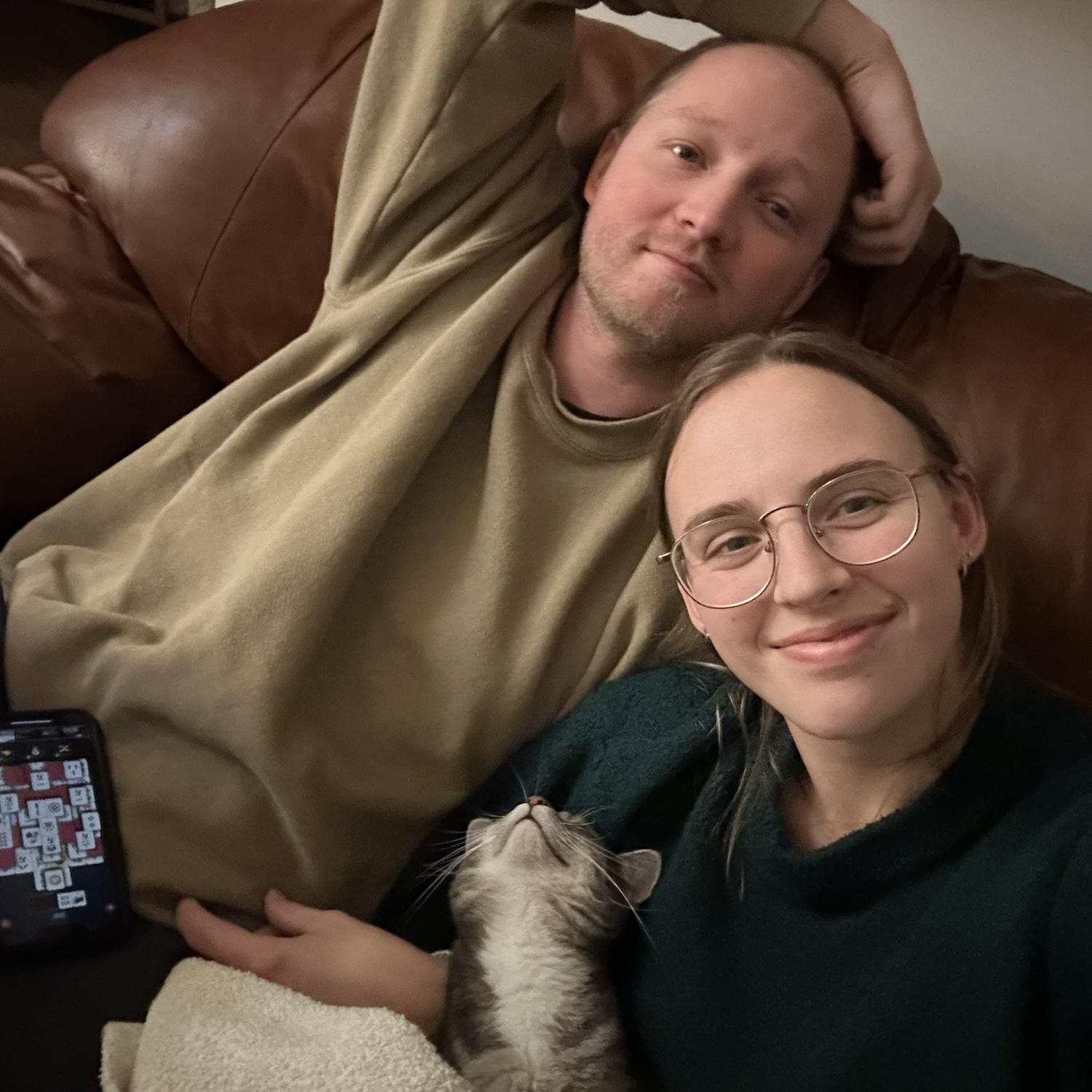 Sam and Belle hanging out with their cat Merian!