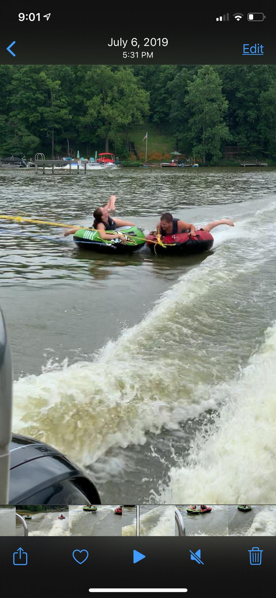 Lauren and Best Man Tshade Tubing and enjoying a Busch light last July on Holiday lakes!