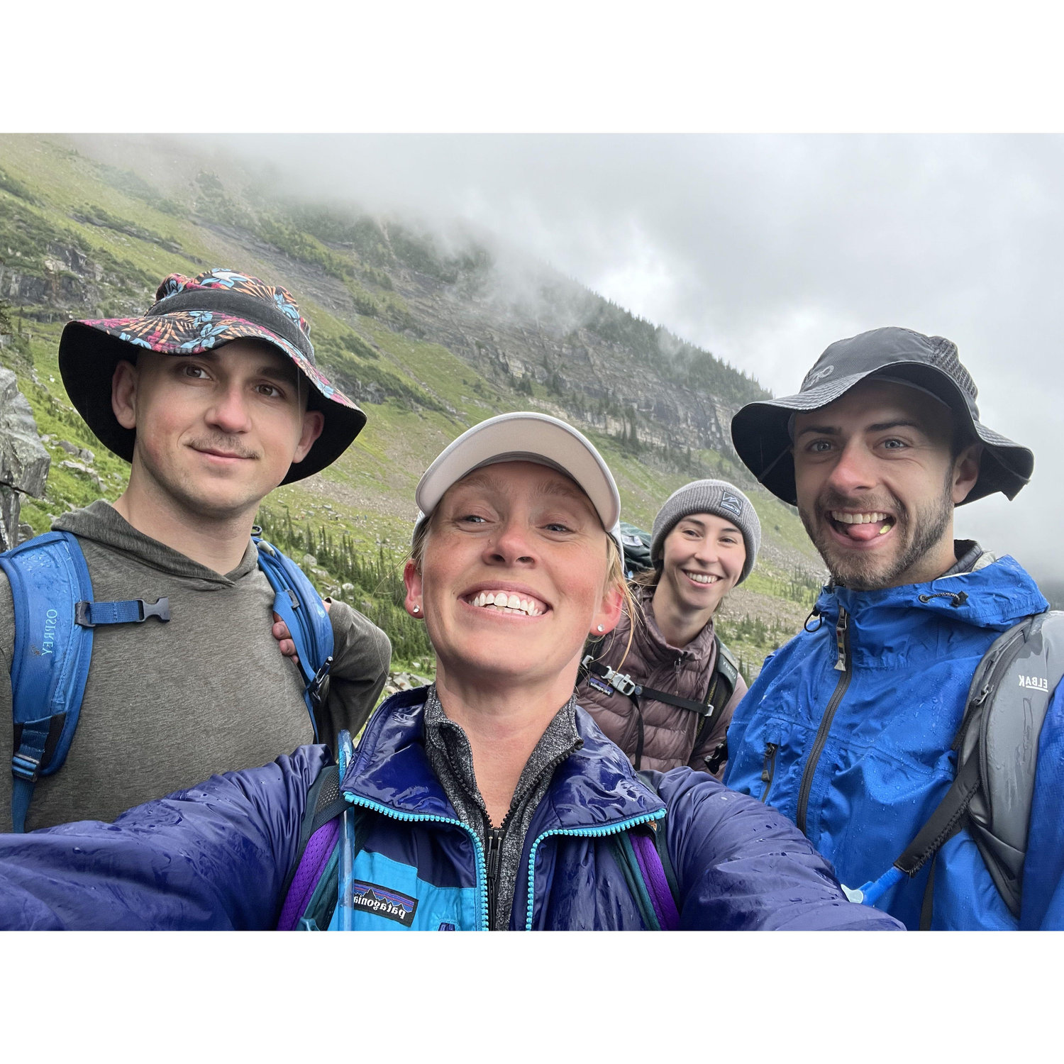 Hiking our way through the clouds of Glacier National Park with Maid of Honor Rachel and her partner Costa
