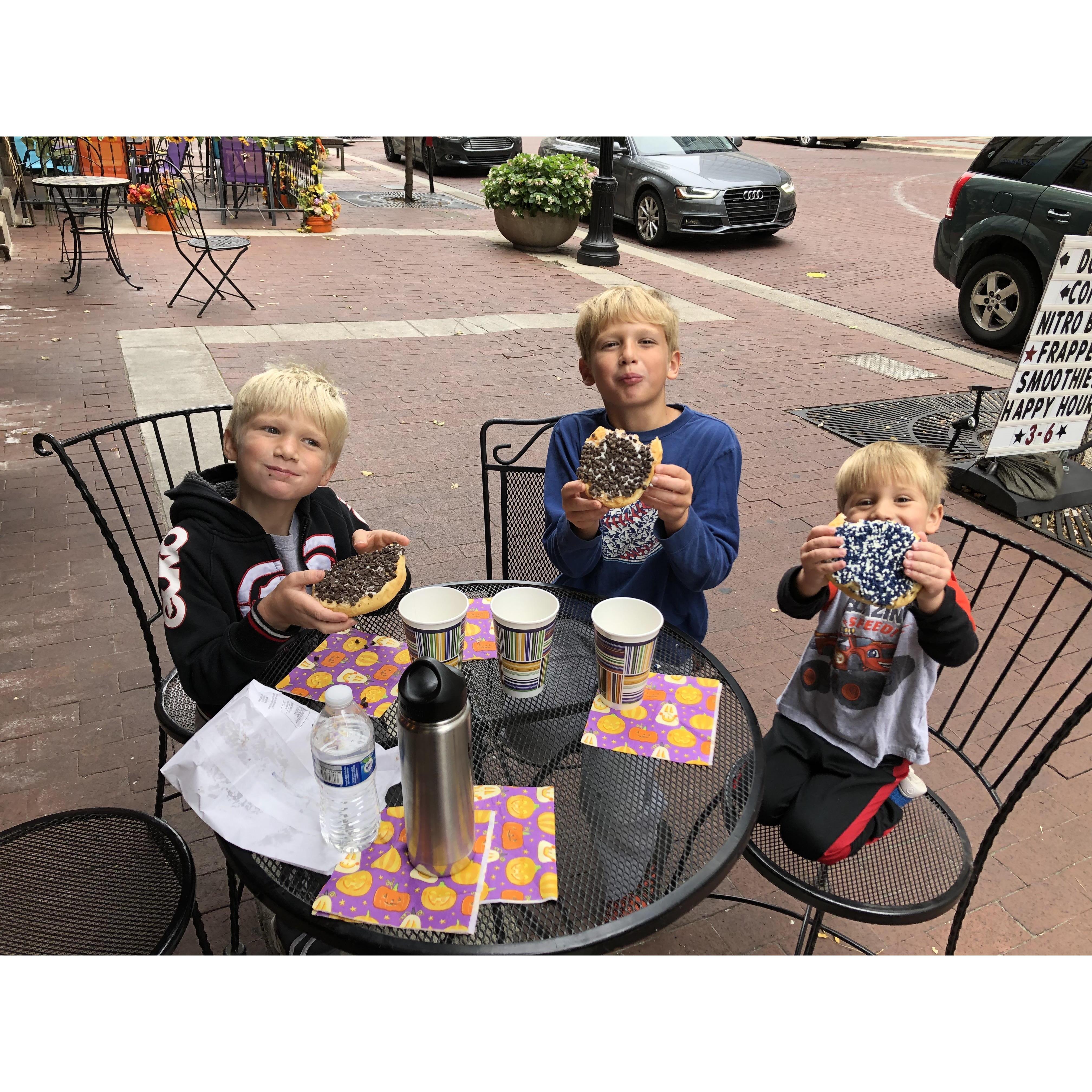 Donuts as big as your head! Zach, Jackson and Bobby having breakfast on the circle at Jack's Donuts.