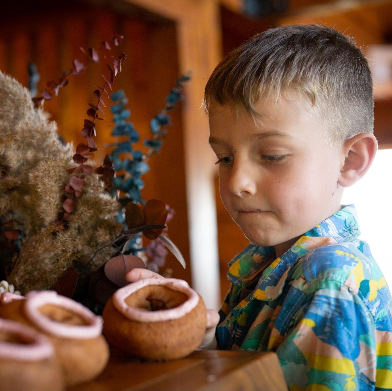 Trent sneaking doughnuts.