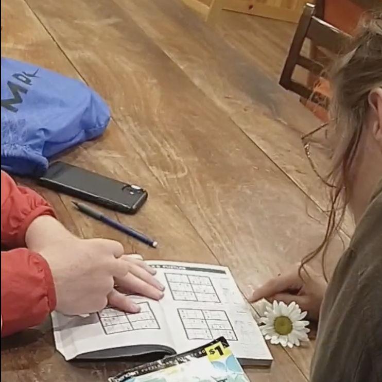 We met working at a summer camp in 2021. We passed a sudoku book between us during meals. First, we just did the puzzles, then we started writing notes to each other.