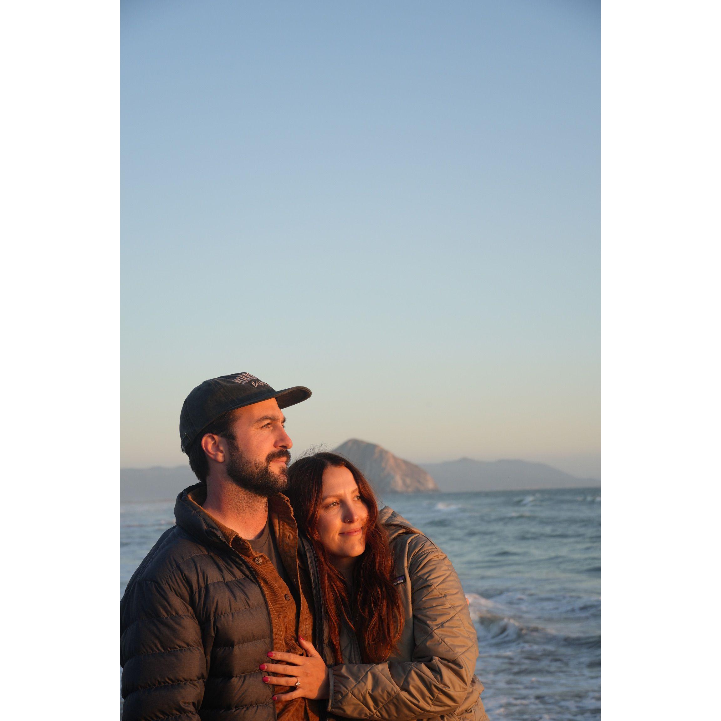 Recent photo of us in Morro Bay (ring sparkling in the sunset and all!)
