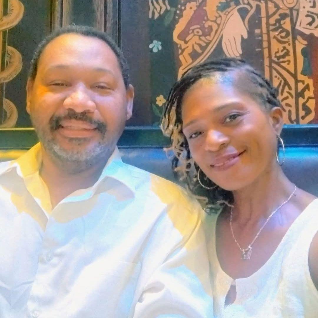 Celebrating our anniversary on a cruise to the Bahamas—dressed in white, smiling, and enjoying the moment together.