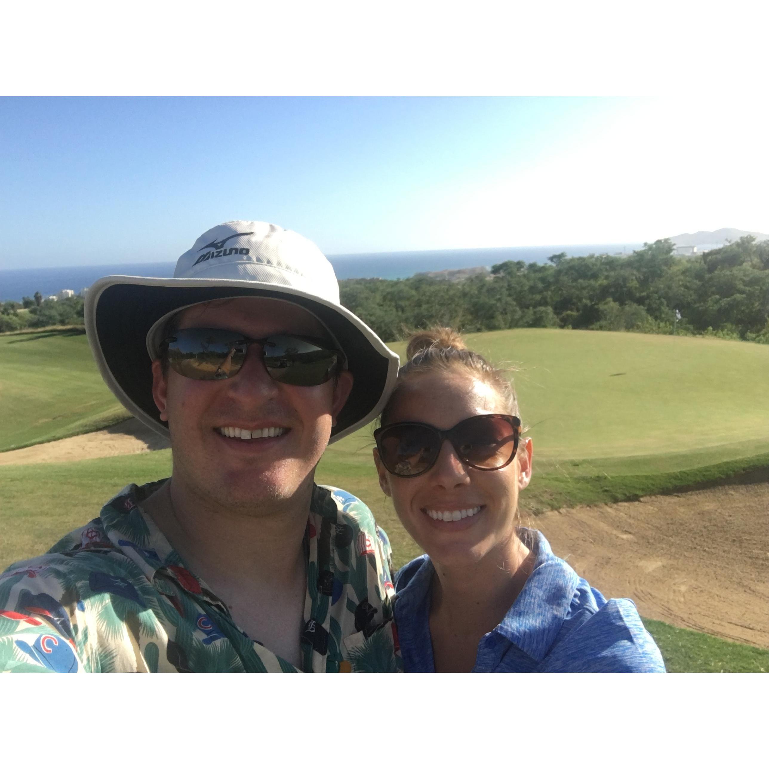 In our happy places - a golf course for David and the hot, tropical sun for me :)