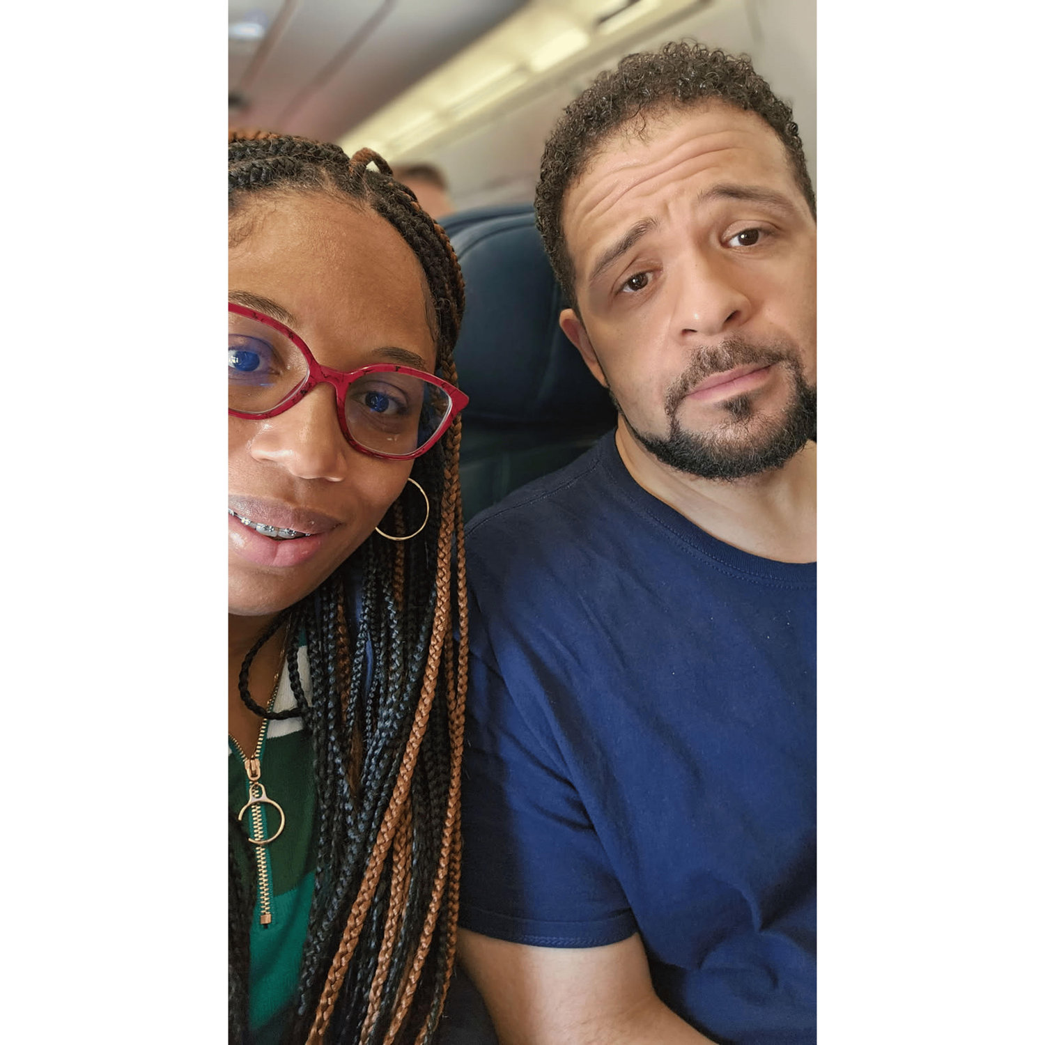 Our first plane ride together. Someone's scared!