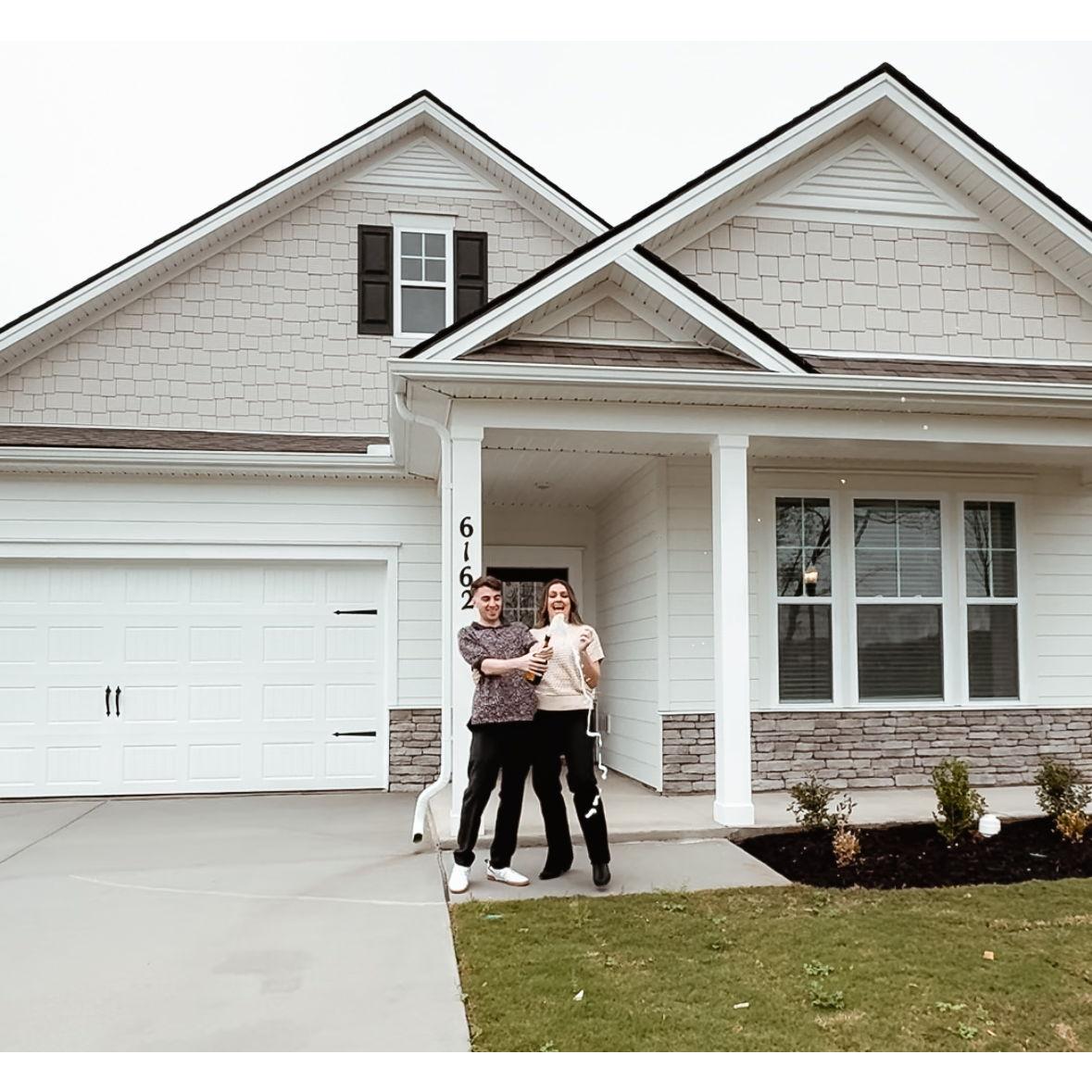 Popping champagne after signing the papers for our first home!!