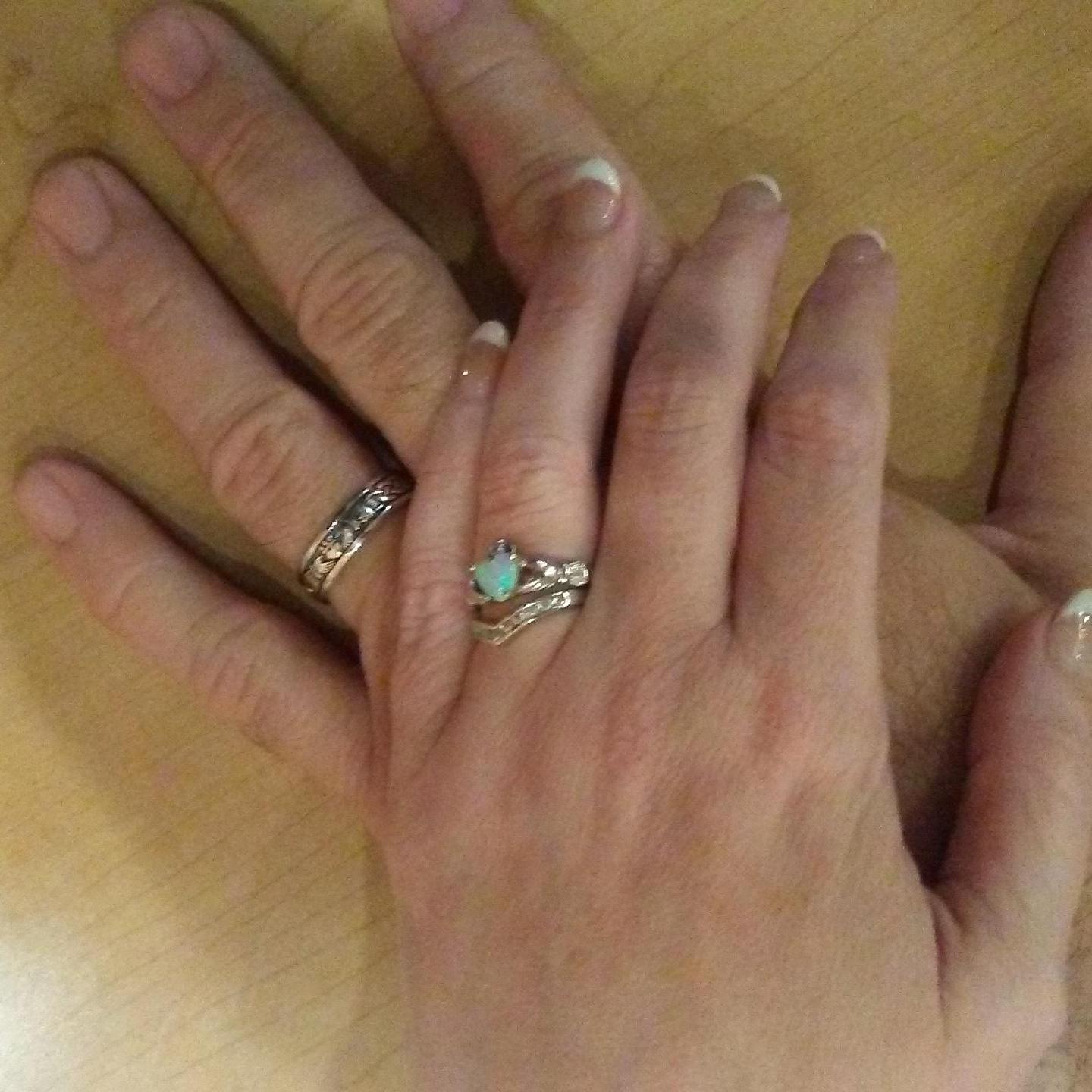 Our rings are called a Claddagh ring and are very symbolic. The heart, of course, is love; the crown above represents loyalty; and the hands holding the heart are for faith and friendship.