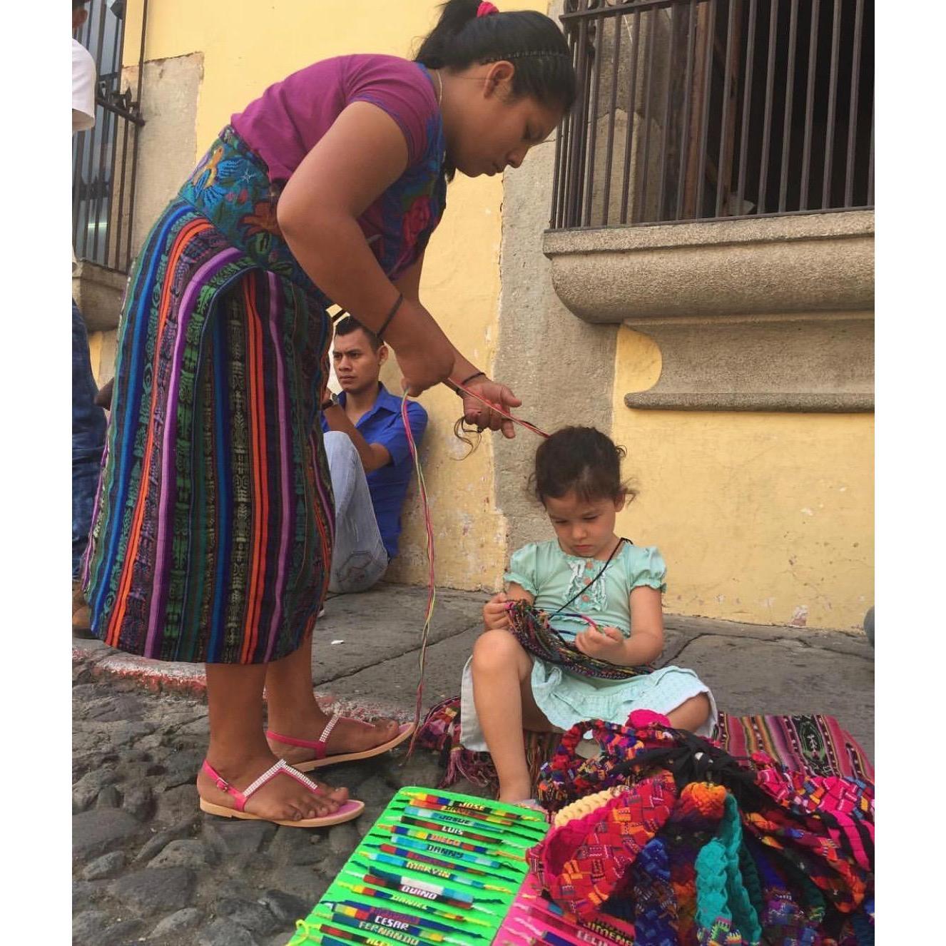 Lucia getting a hair braid in Antigua