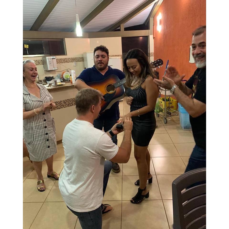 The proposal was in Brazil, he asked my cousin to play a Elvis Presley song and asked me to dance. He got on his knees in front of my family and friends at my hometown. It was like a DREAM!