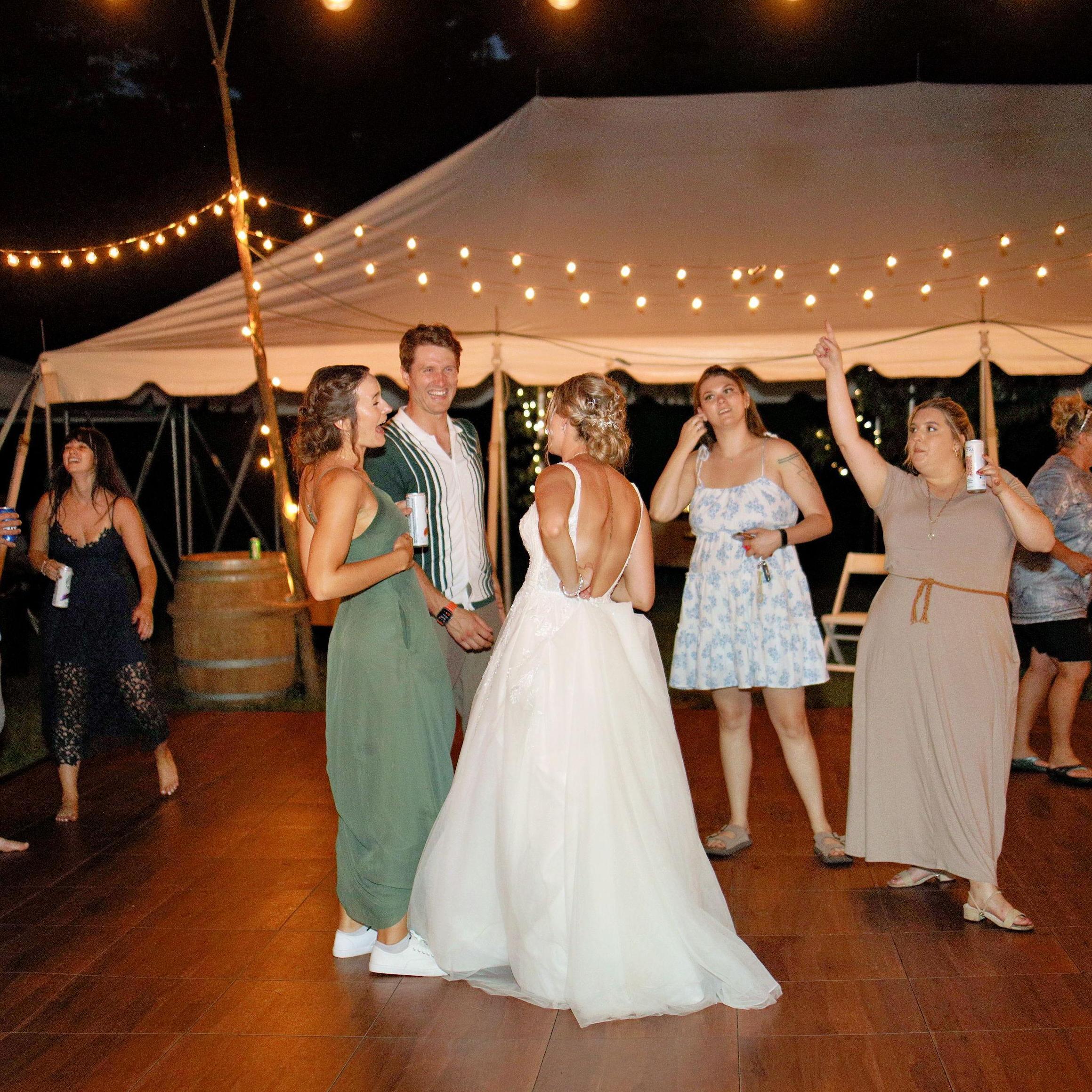 Lighting up the dance floor at the wedding of bridesmaid Madison Guy. July, 2024.