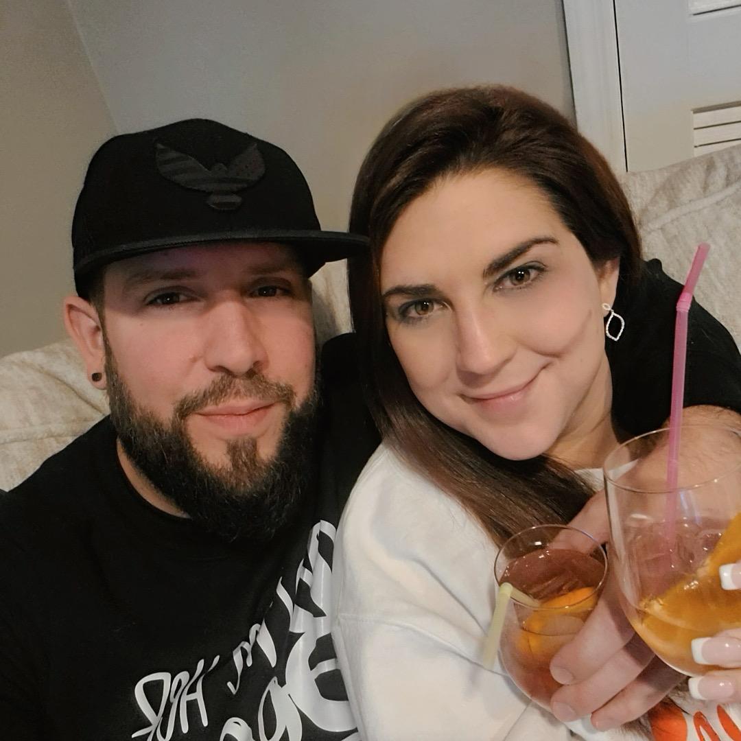 Enjoying our signature cocktail - a Bahama Baybreeze - though David *rarely* drinks. Our Halloween themed shirts read "I'm his witch!" and "I'm her boo!"