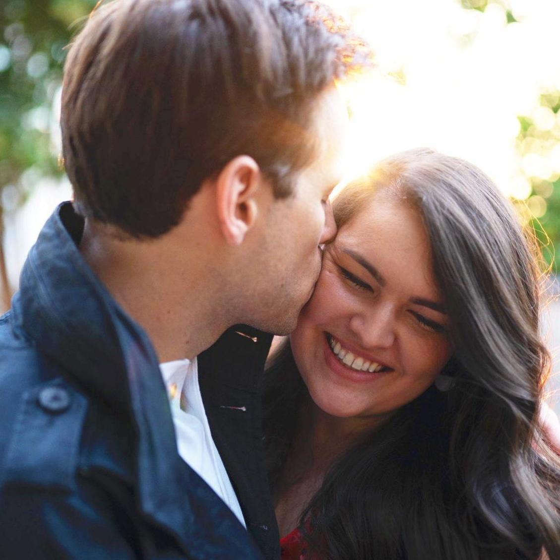 Stealing kisses during engagement photos in Charlotte - August 2019