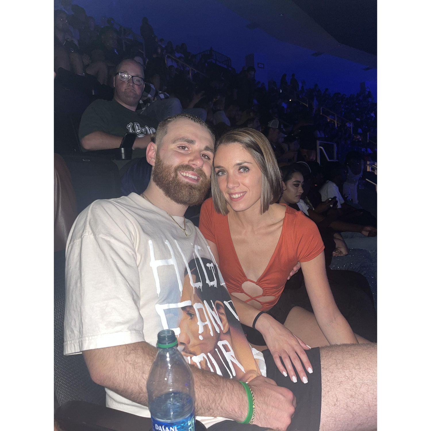 Drake concert featuring Andrews corn rows and the lovely gentleman in the back