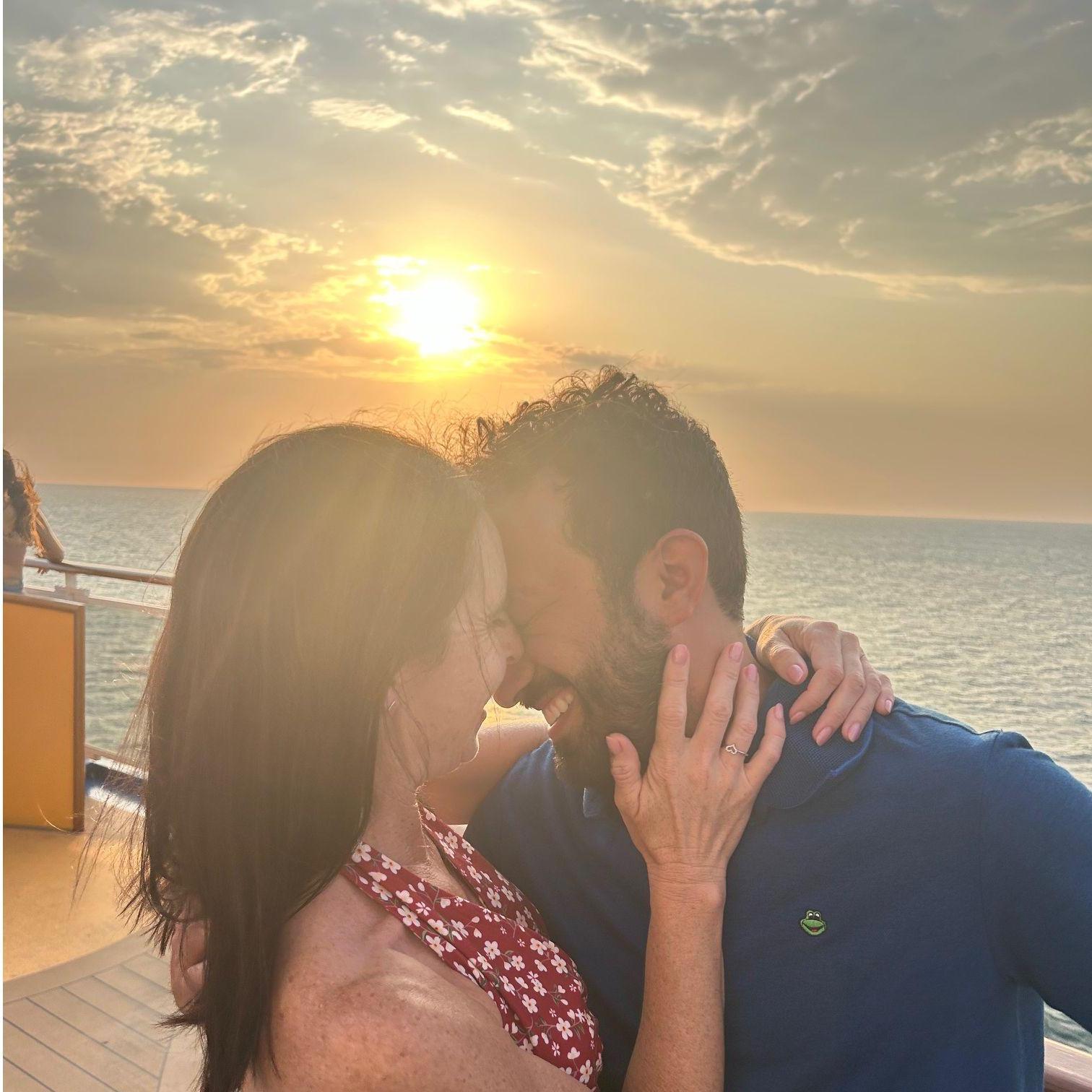 Kissing on the boat as we sail in the middle of the Pacific Ocean.