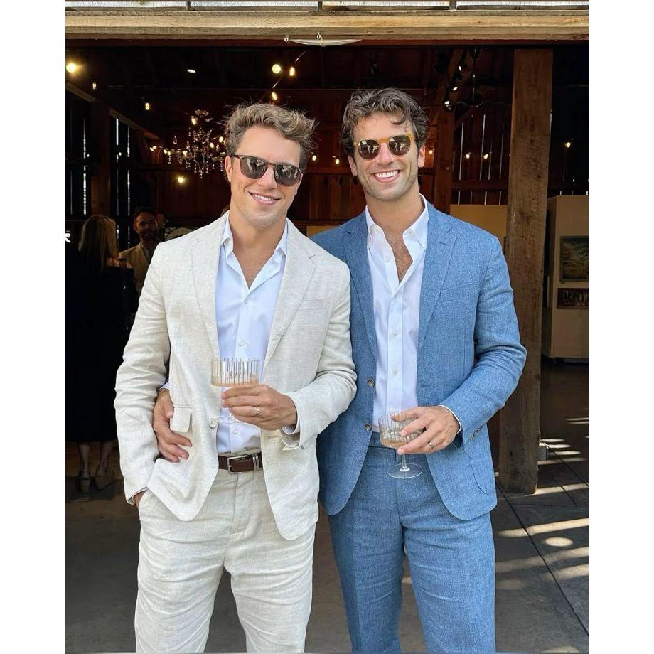 Men - any suit color is acceptable, tie is optional.