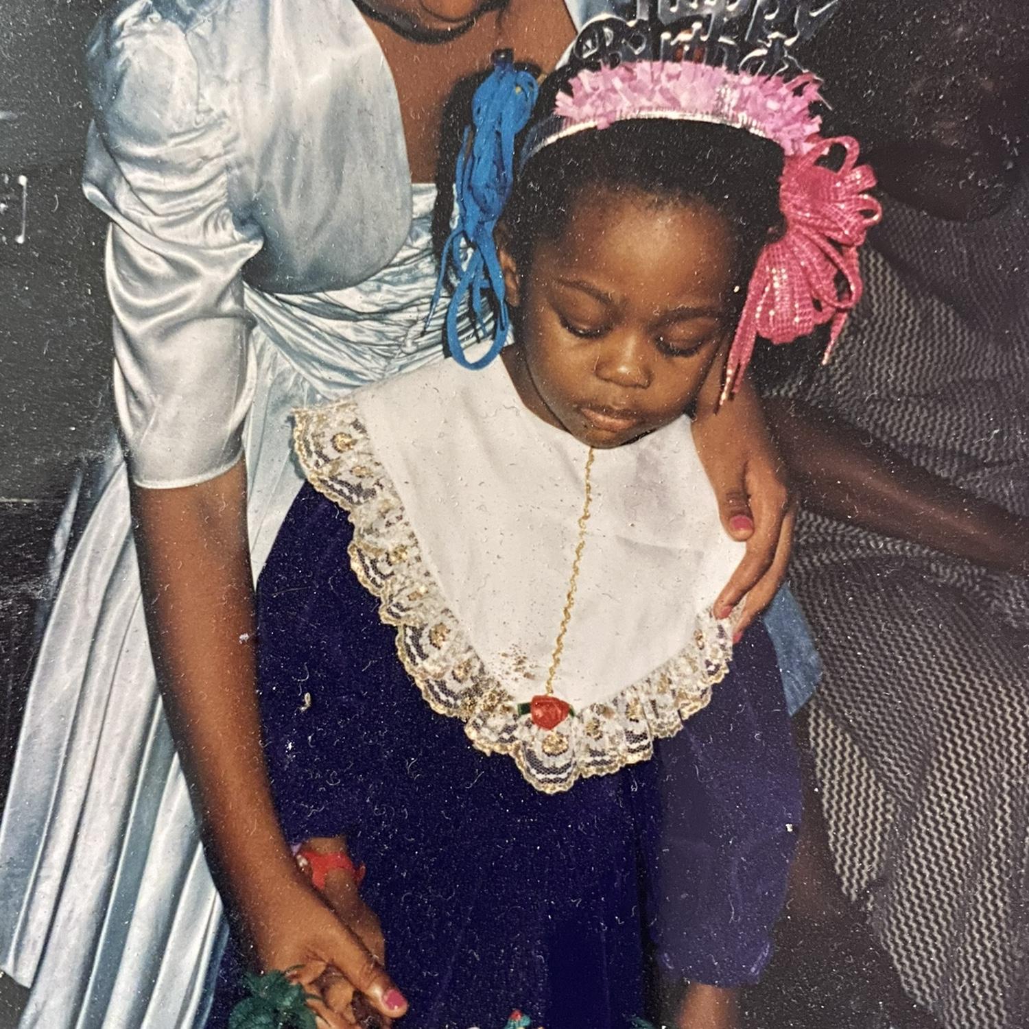 Joy, age 3 – just look at how seriously she took cutting her birthday cake!