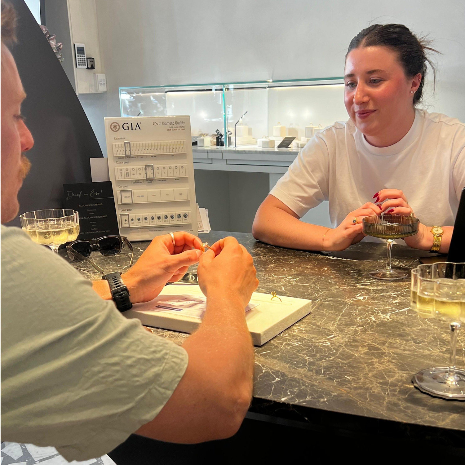 Seeing the engagement ring for the first time with Wednesday - our ring specialist. The bubbles were flowing!