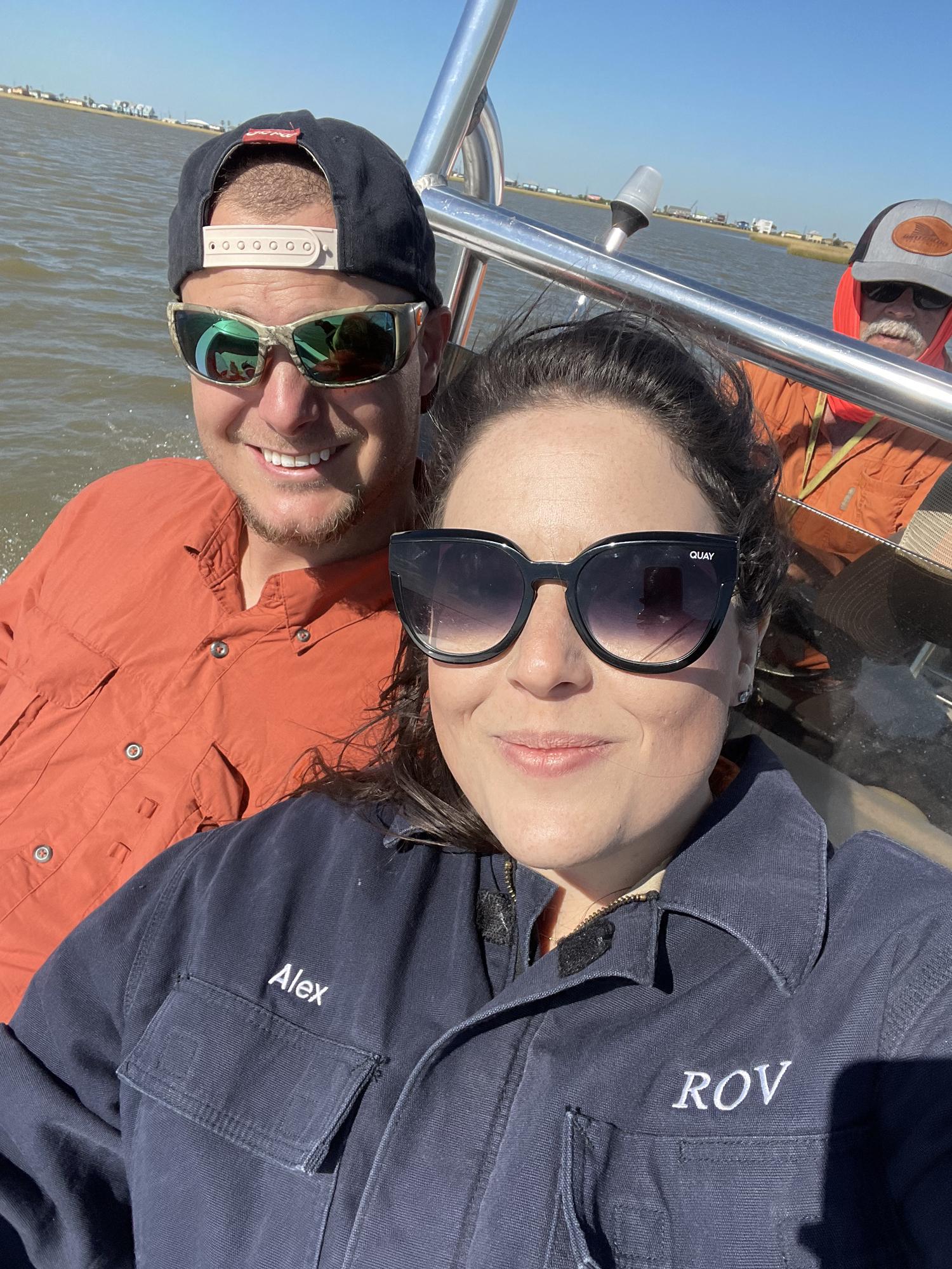 Alex and Eugene teaching Natalia to fish