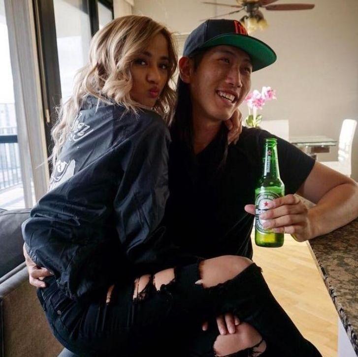 In true Soohoo fashion: Beer in one hand, and Kate in the other.