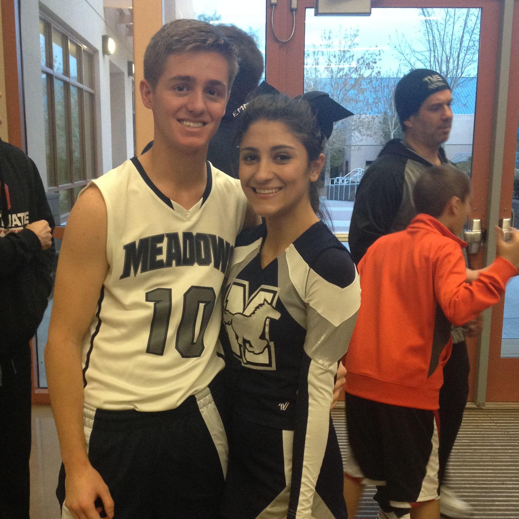 Emma loved cheering for Logan's basketball games. Logan loved cheering too because he was on the bench the whole time.