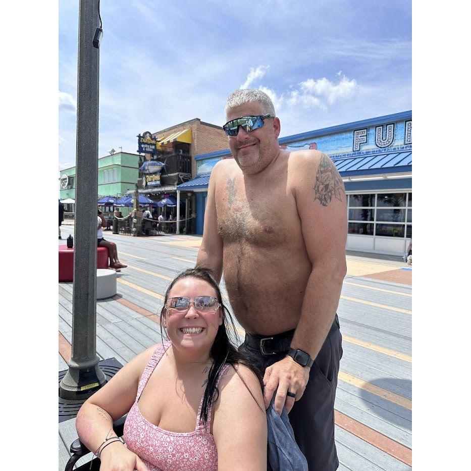 In sickness and in health- Jason pushing me in a wheelchair at the boardwalk