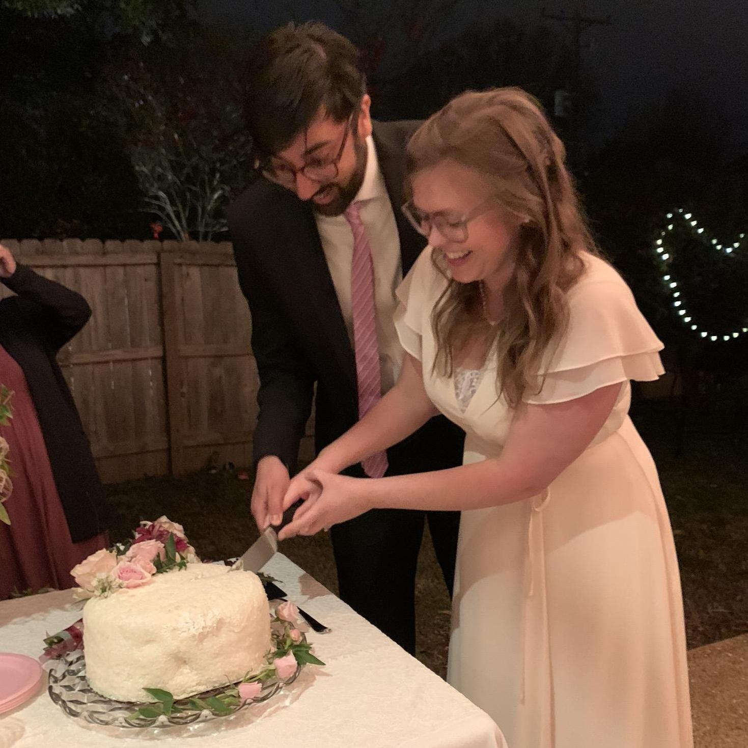 Cutting the cake (it was coconut)
