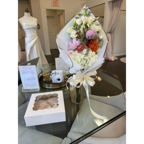 july 11, 2025 -- braeden surprised kennedy with flowers and cookies at a bridal appt!