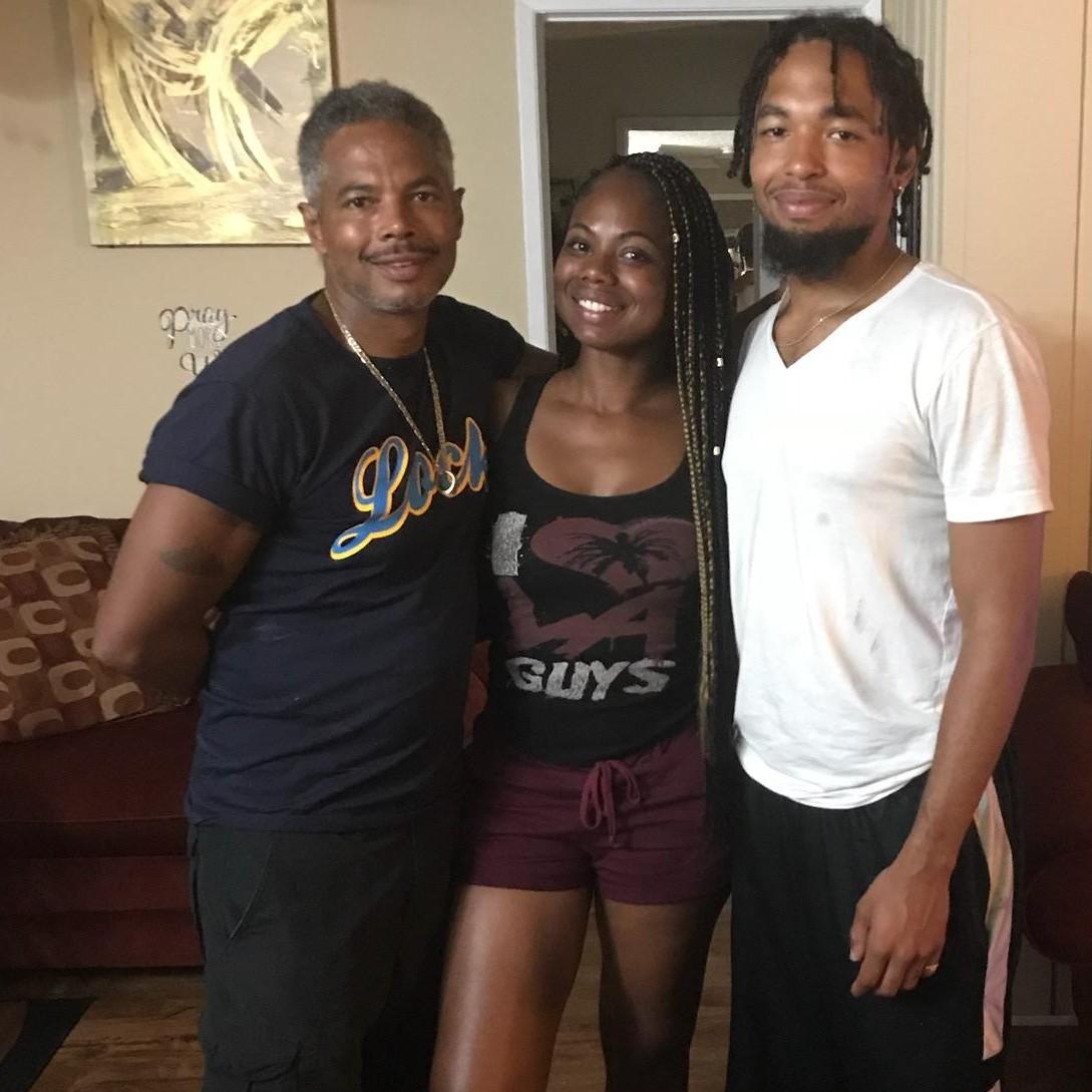 Mechellé with her father and younger brother.