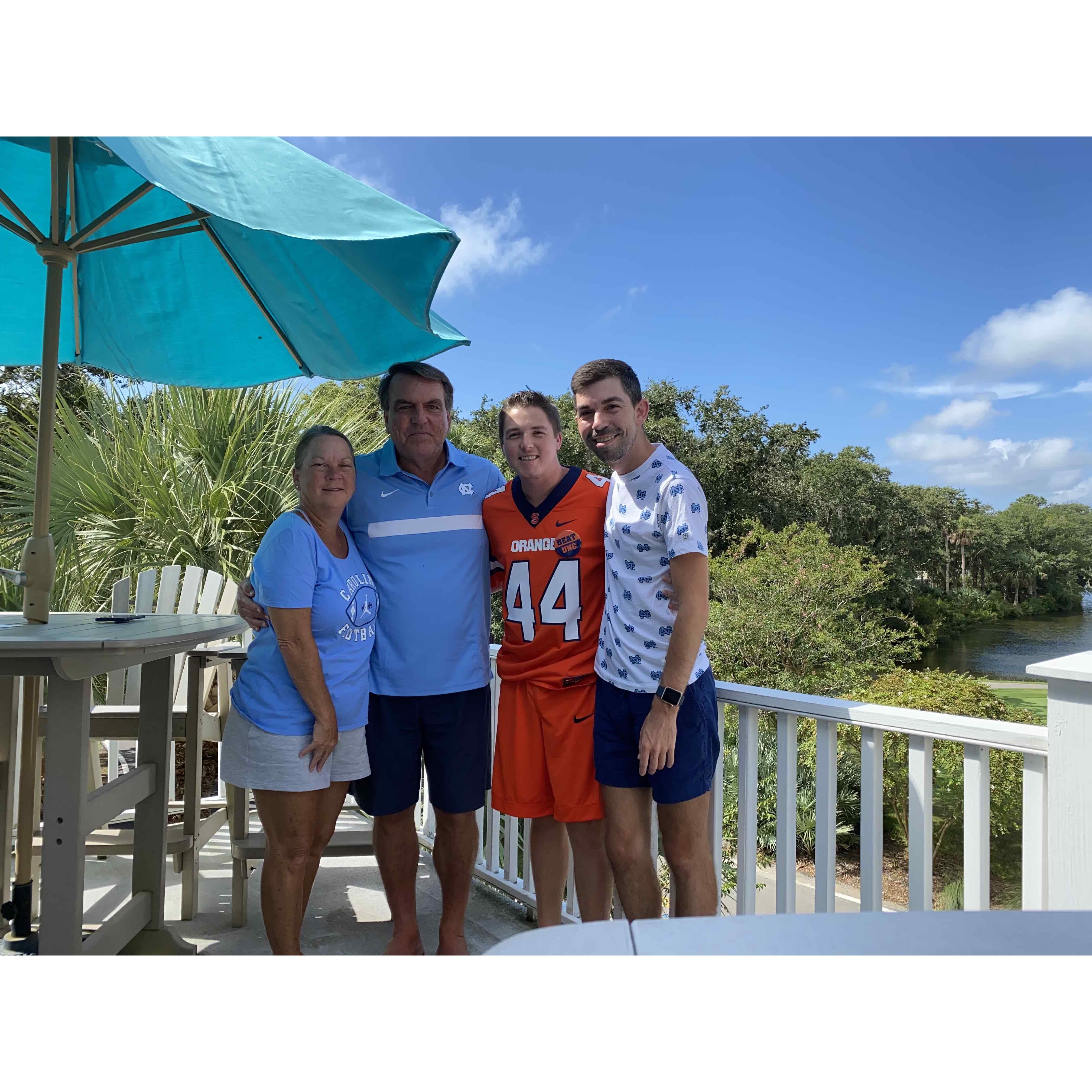 Bradley & Jacob, with Bradley's parents Lisa and Tony, (mostly) rooting on the Tar Heels from the beach!