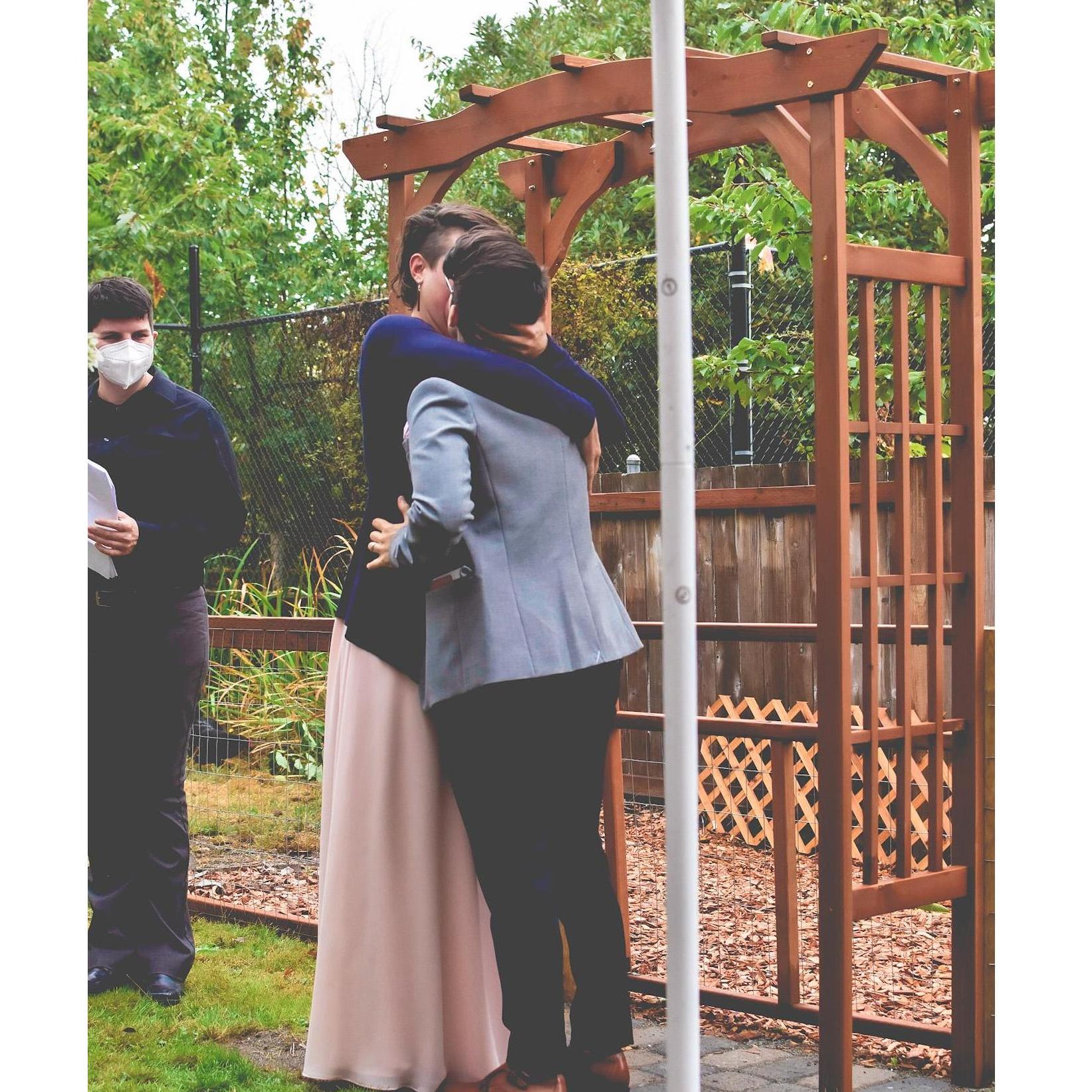 "Now, by the power vested in me as your officiant, friend, and chosen family, I am honored to pronounce you as partners in life, love, and community together."