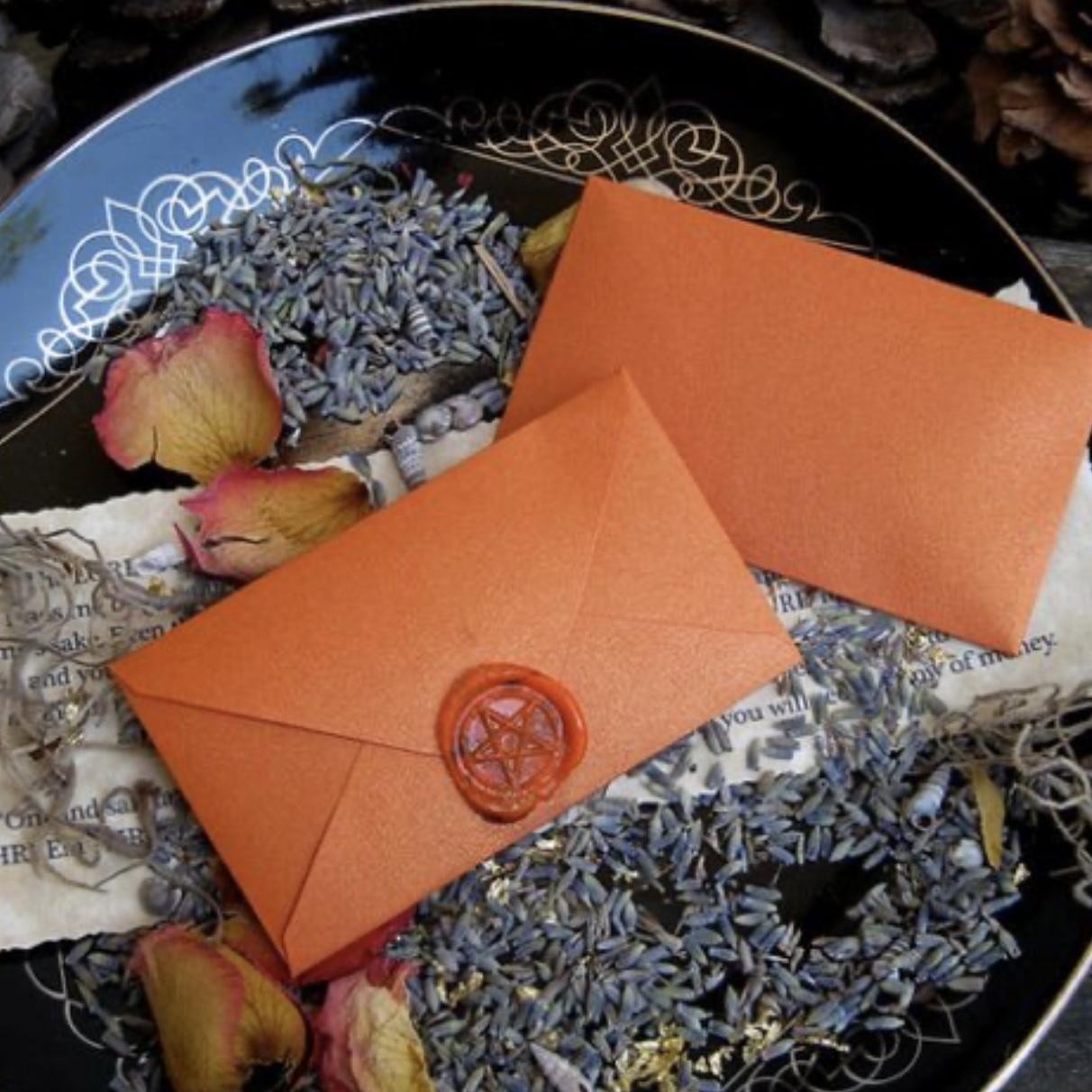 The pagan urge to offer pick-a-spell envelopes to guests.