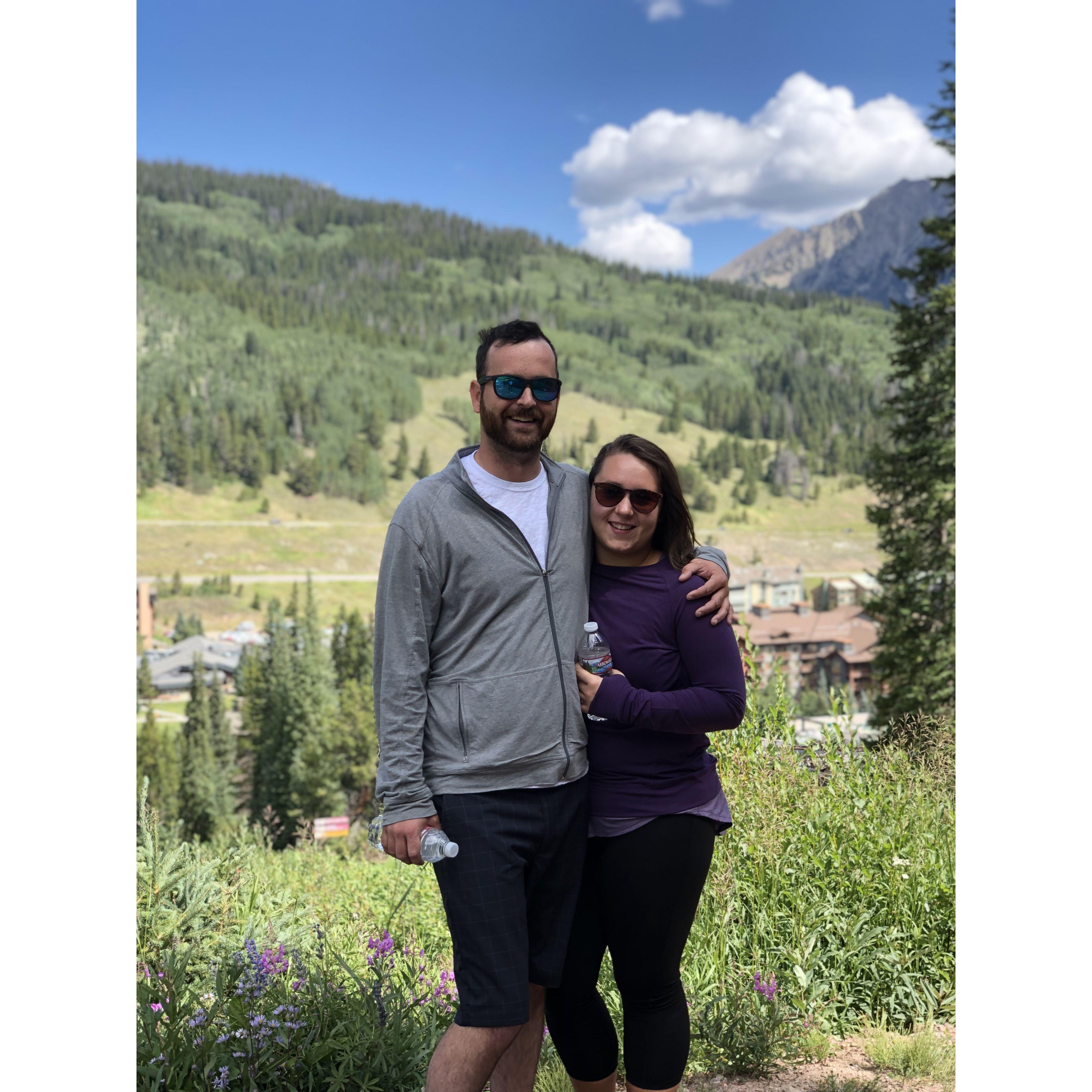 Hiking in Colorado and attending our first wedding together.