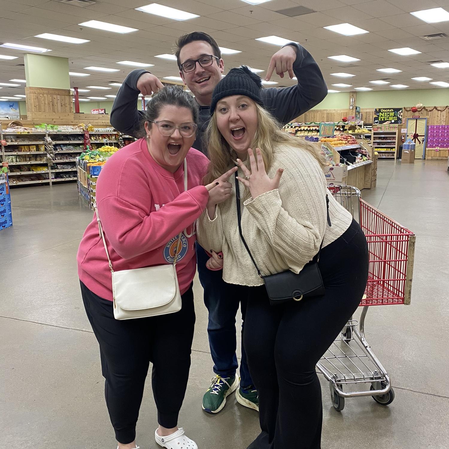 Brad & Amber Dawn with Lexi (in a Trader Joes) the evening of their engagement, 2023