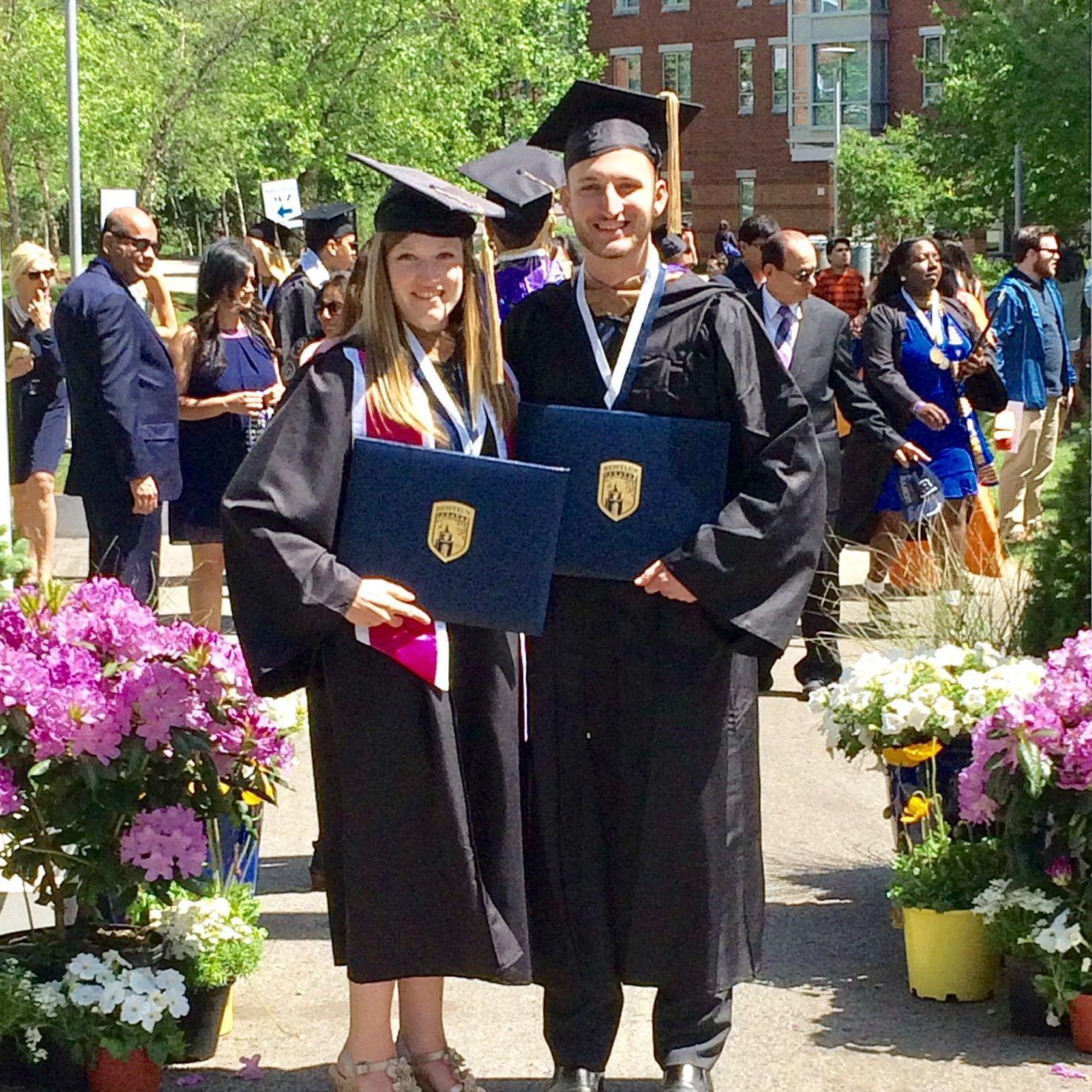 Caitlyn and Anthony graduating from Bentley University in 2017.