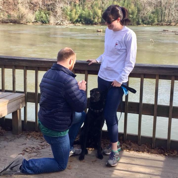 Hunter proposing (to Miller) during a hike along the Chattahoochee River on December 26, 2017.
